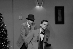 Simon looking mildly miffed at being arrested